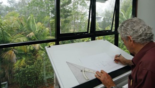 Ralph Bailey at drawing-board: “This design is quite specific to the rainforest creek, main road and site. It's as if the vagaries of allotment are every bit as unique as human fingerprints.”